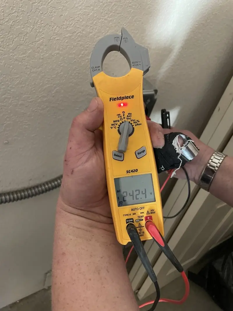 Voltage testing with clamp meter during Outlet Installation in Lynn Haven